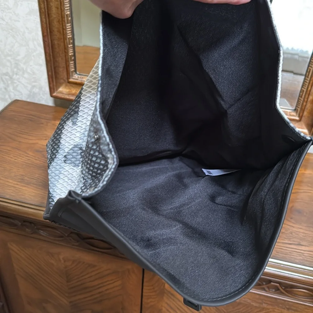 New Rains Black and Gray Unisex camo look Backpack.